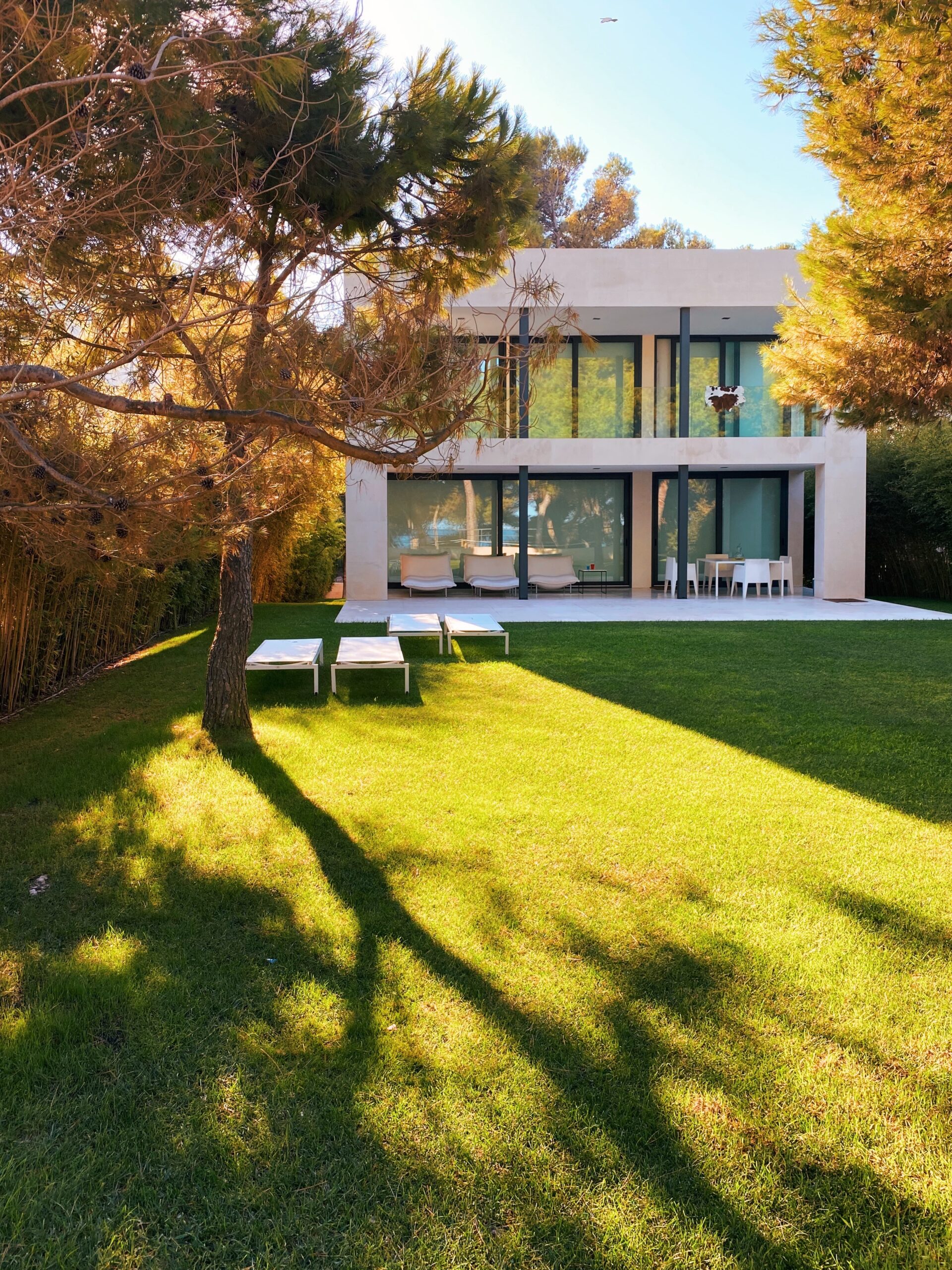 Exterior of modern house with large windows and glass doors